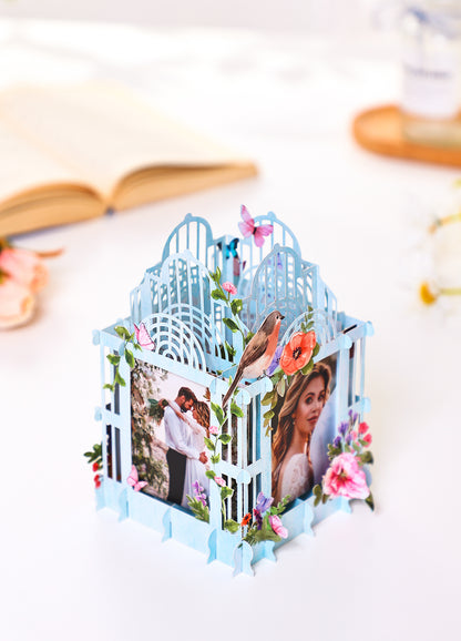 Colorful blue cage three-dimensional photo frame with flowers